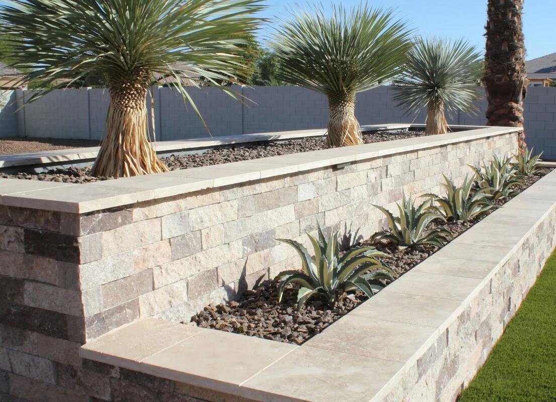 Stone retaining wall with agaves in San Tan Valley, AZ