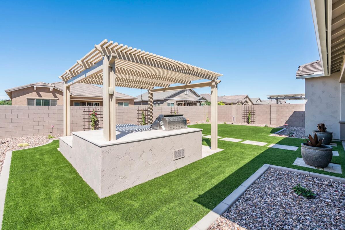 Pergola with BBQ island and turf in Gilbert, AZ