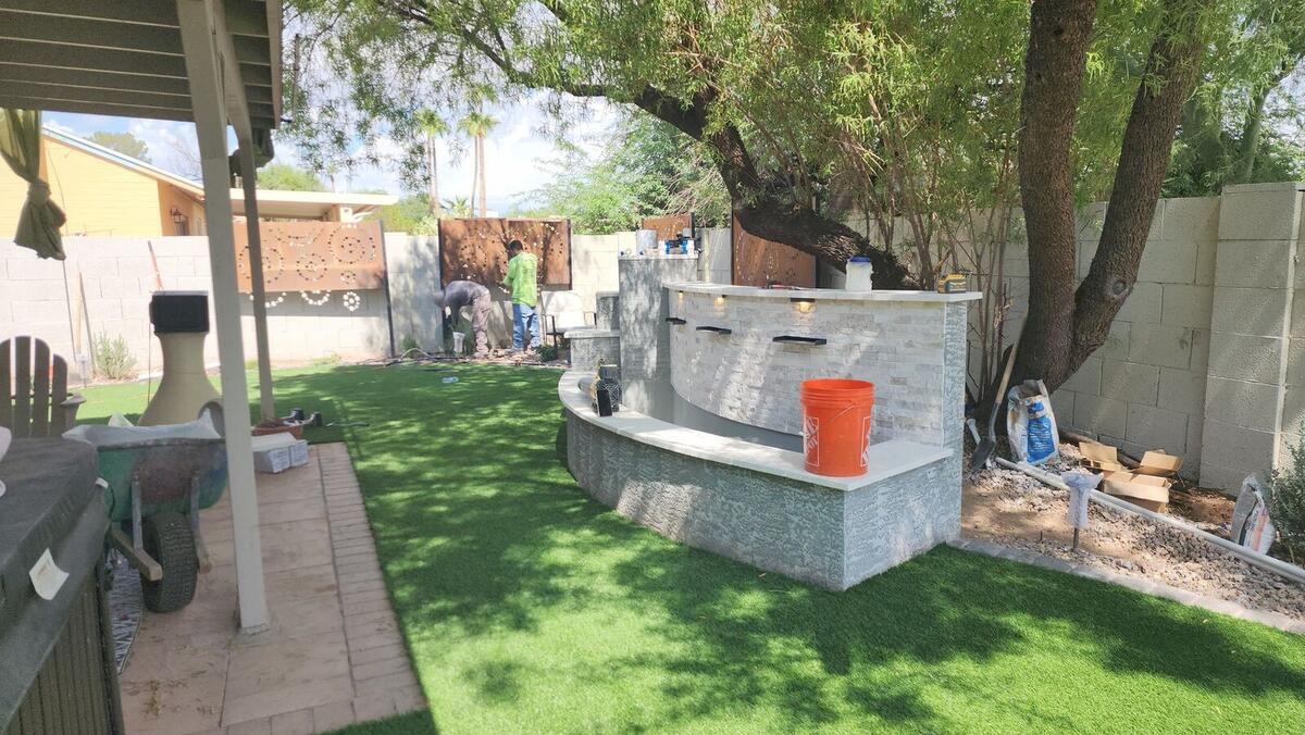 Complete backyard with outdoor kitchen and water feature in Tempe, AZ